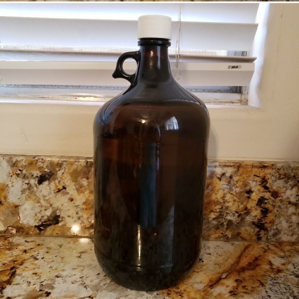 4 Amber glass jugs